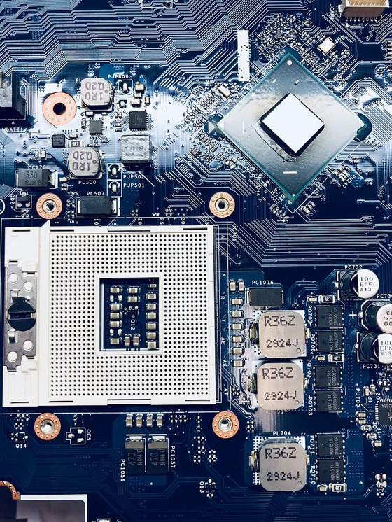Close-up of a laptop motherboard during repair
